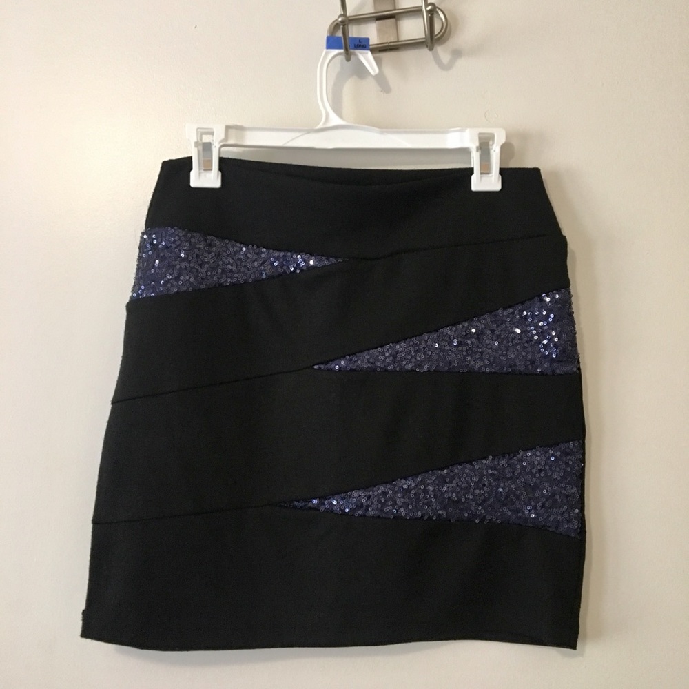 Black midi skirt with blue sequined accent.